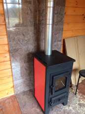 Купить стальной камин Везувий ПК-01 (270) в Гомеле фото в интерьере в Гомеле