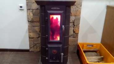 Стальная печь Термофор Статика Тетра, чёрная бронза фото в интерьере в Гомеле