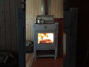 Стальной камин со стеклом Теплодар Кадриль фото в интерьере в Гомеле