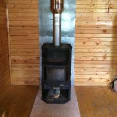 Печь-камин с шамотом Мета-Бел Ангара-Аква в интерьере фото в Гомеле