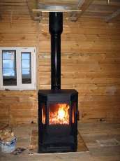 Печь-камин Бавария водяной с плитой в интерьере в Гомеле