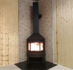 Стальной камин Бавария Мюнхен угловой чёрный (без перемычки) фото в интерьере в Гомеле