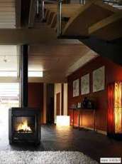 Печь-камин чугунный Invicta Carolo в интерьере Амазонка бай фото  в Гомеле