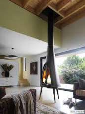 Печь-камин чугунный Invicta Pow-Wow в интерьере Амазонка бай фото в Гомеле