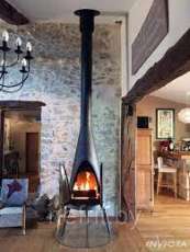 Печь-камин чугунный Invicta Pow-Wow в интерьере Амазонка бай фото в Гомеле